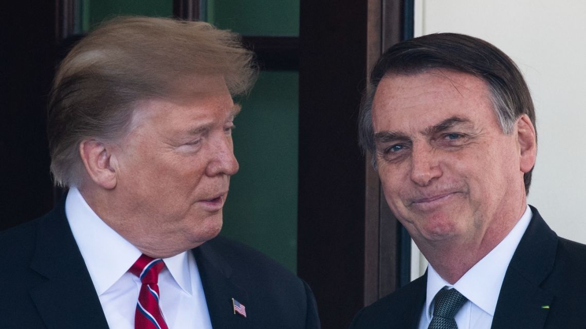 US President Donald Trump (L) welcomes Brazilian President Jair Bolsonaro (R) to the White House in Washington, DC, on March 19, 2019.