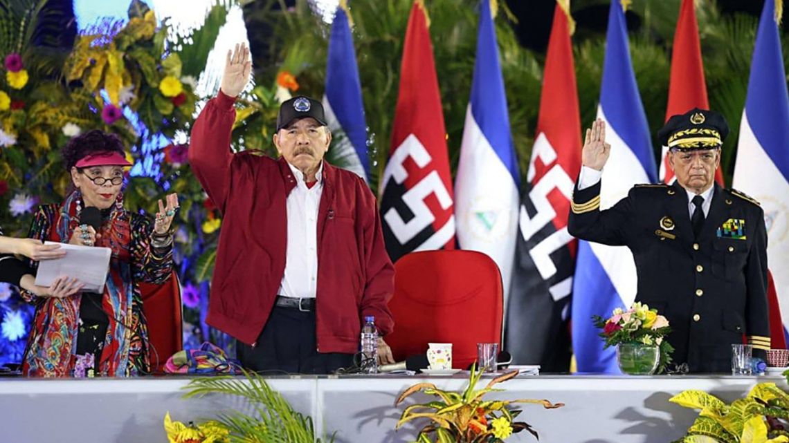 Handout picture published by the official news outlet El 19 Digital shows Nicaragua's President Daniel Ortega (C), his wife, Vice-President Rosario Murillo (L), and the Police Commander Francisco Javier Díaz Madriz during his swearing-in ceremony in Managua on February 26, 2025.