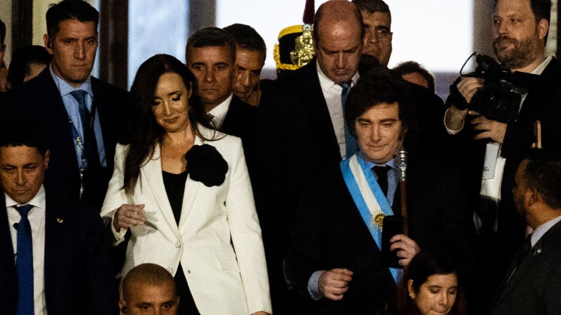 President Javier Milei leaves the National Congress accompanied by Vice-President Victoria Villaruel after delivering his speech to Congress at the inauguration of the 143rd ordinary session of Congress in Buenos Aires on March 1, 2025. 