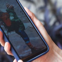 Azul Vieiro, 44, daughter of the late legendary mountaineer Guillermo Vieiro, looks at a picture of his father in her mobile phone during an interview in Mendoza, Argentina, on February 28, 2025.