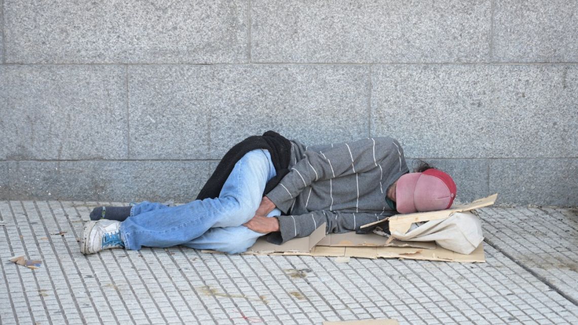 A man sleeps outside Constitución train station in Buenos Aires on March 10, 2025. 