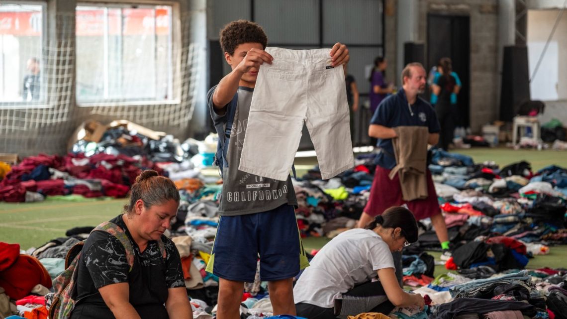 People choose donated clothes in Bahía Blanca, 600 km south of Buenos Aires on March 10, 2025.