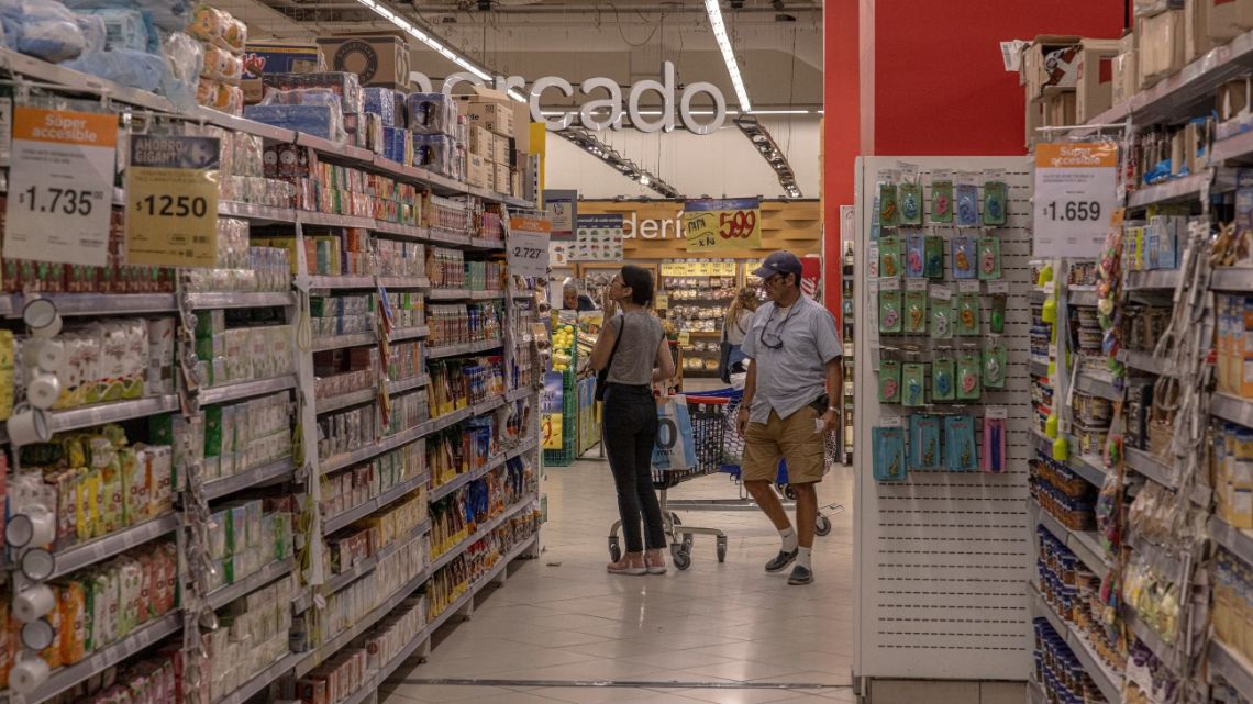 Shoppers browse products in a supermarket in Buenos Aires, Argentina.