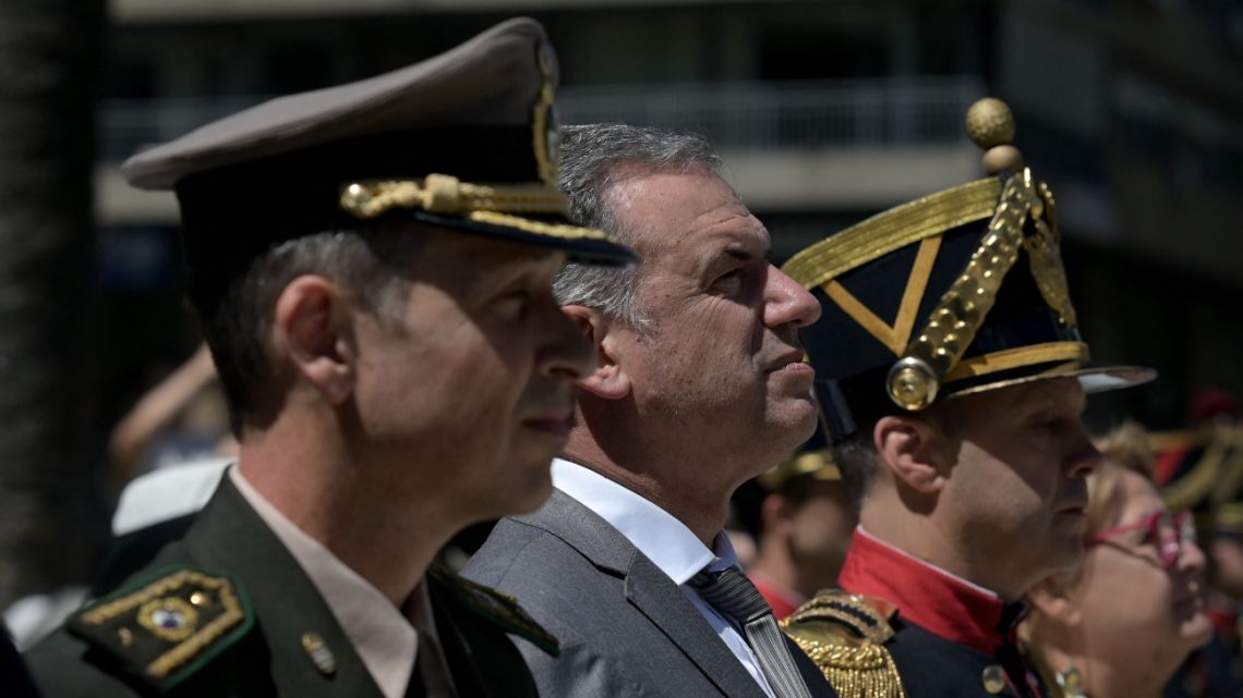 Uruguay's President Yamandú Orsi (C) observes the first changing of guard of his term in office in front of national hero José Artigas' monument at Independence Square in Montevideo on March 10, 2025.