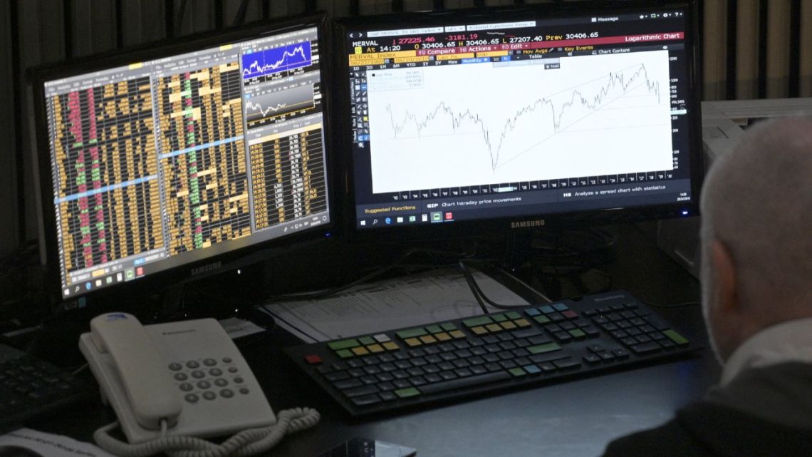 A broker looks at a screen at the Buenos Aires Stock Exchange in the financial district of Buenos Aires.