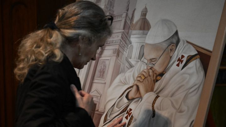 A faithful Catholic prays at Basilica San José de Flores in Buenos Aires on April 21, 2025, following the death of Pope Francis in the Vatican.