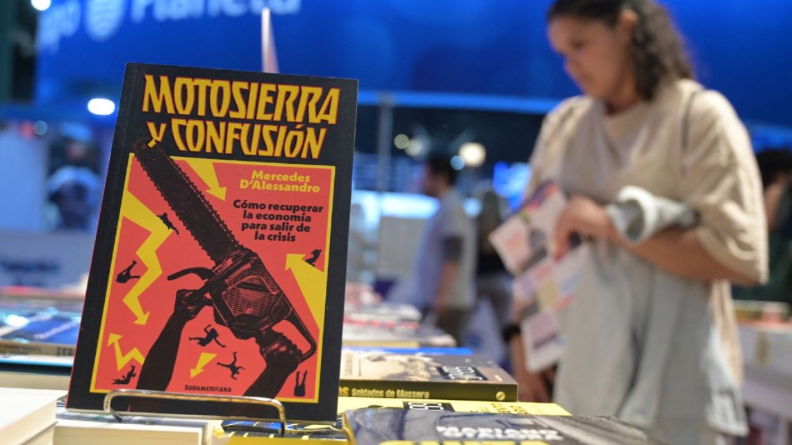 Books about Argentina's President Javier Milei are displayed for sale at the Buenos Aires International Book Fair at La Rural exhibition centre in Buenos Aires on May 7, 2025. 