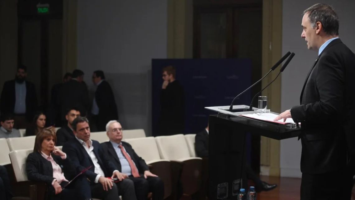 Presidential Spokesperson Manuel Adorni gives a press conference at the Casa Rosada, as Security Minister Patricia Bullrich and other officials look on.