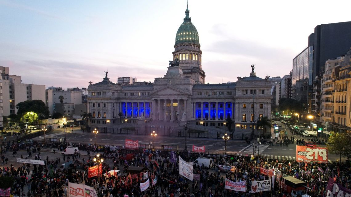 People take part in the weekly march of retirees with multi-sector support against President Javier Milei's government outside the National Congress in Buenos Aires on June 4, 2025.