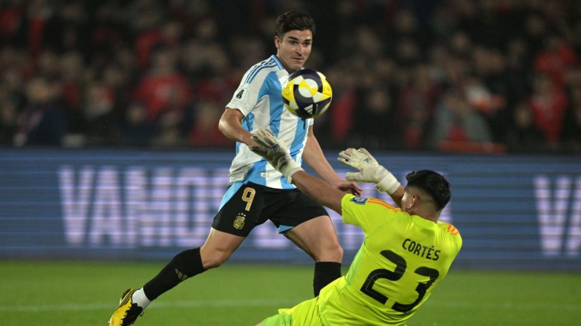 Argentina's forward Julián Álvarez kicks the ball to score past Chile's goalkeeper Brayan Cortes during the 2026 FIFA World Cup South American qualifiers football match between Chile and Argentina at the Nacional Julio Martínez Pradanos stadium in Santiago, on June 5, 2025. 