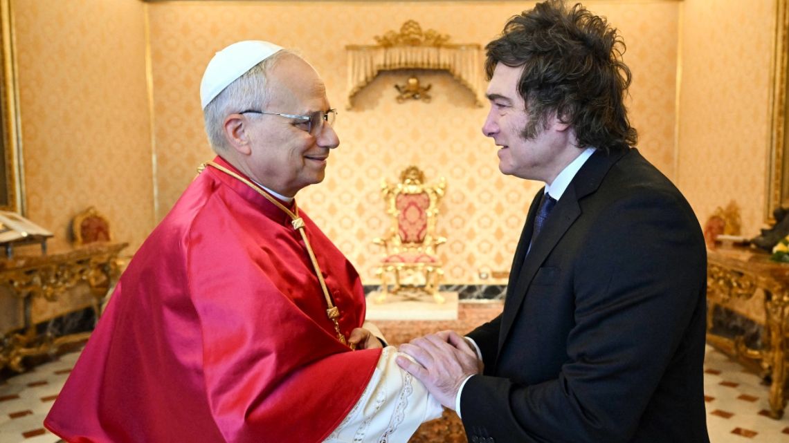 This handout photograph taken and released on June 7, 2025, by Vatican Media shows Pope Leo XIV meeting with Argentina's President Javier Milei during a private audience at the Vatican. 
