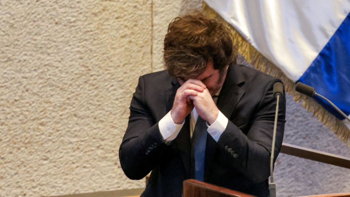 Argentina's President Javier Milei reacts as he addresses the assembly during a session of the Israeli parliament (Knesset) at its headquarters in Jerusalem on June 11, 2025. Milei said on June 11 that his country would move its embassy in Israel to Jerusalem, the status of which is one of the most delicate issues in the Israel-Palestinian conflict. The embassy is currently located near Tel Aviv. Several countries, including the US, Paraguay, Guatemala, and Kosovo have moved their embassies to Jerusalem, breaking with international consensus. 