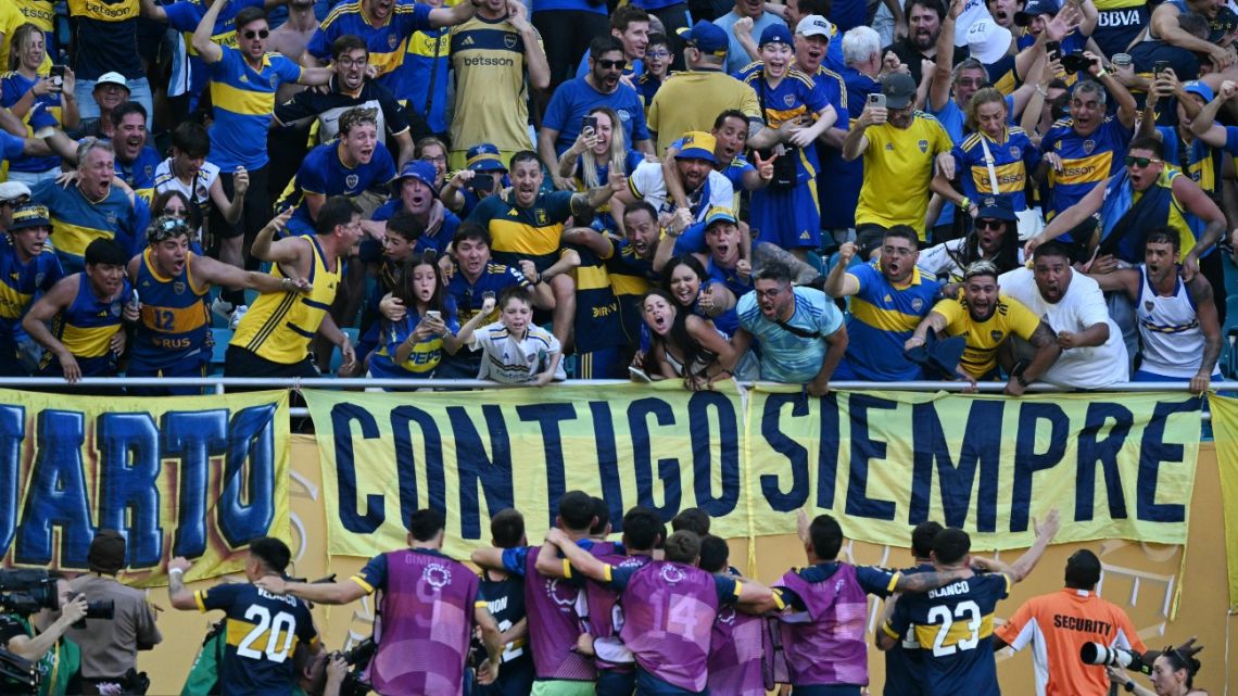 Boca Juniors' Argentine midfielder Rodrigo Battaglia (unseen) celebrates with teammates in front of fans after scoring his team's second goal during the FIFA Club World Cup 2025 Group C football match between Argentina's Boca Juniors and Portugal's Benfica at the Hard Rock stadium in Miami on June 16, 2025. 