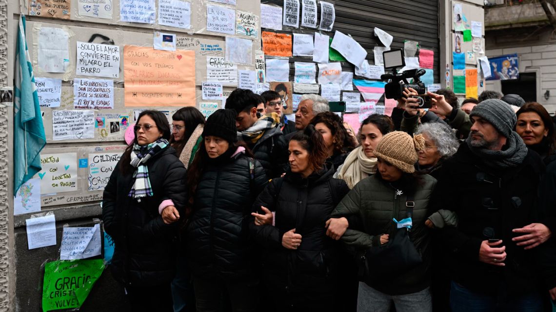 Supporters of Cristina Fernandez de Kirchner stand outside her residence in Buenos Aires on June 17, 2025.