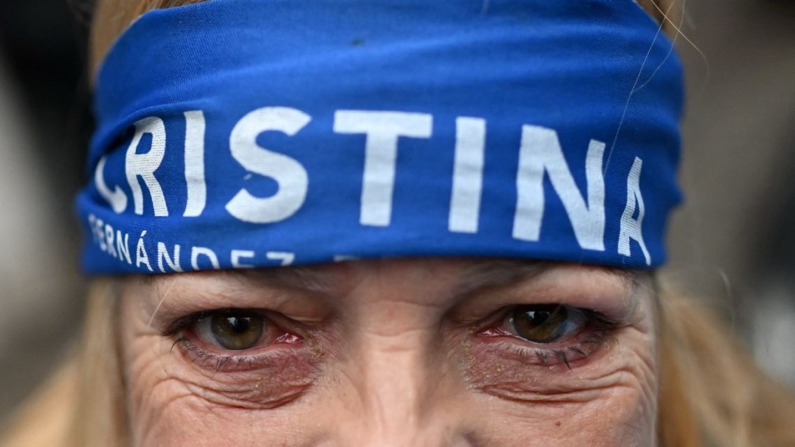 A supporter of Cristina Fernández de Kirchner stands outside her residence in Buenos Aires on June 17, 2025.