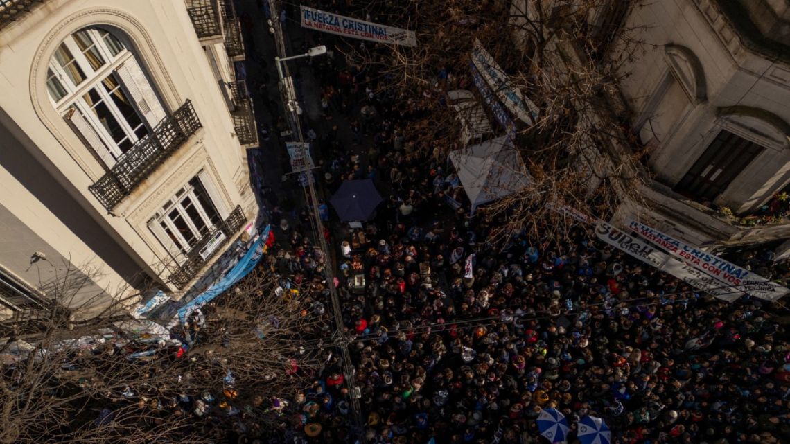 Supporters of Cristina Fernández de Kirchner gather outside her residence before taking part in a protest against her conviction and house arrest in Buenos Aires, on June 18, 2025.