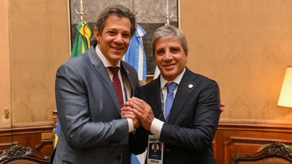 Luis Caputo y Fernando Haddad