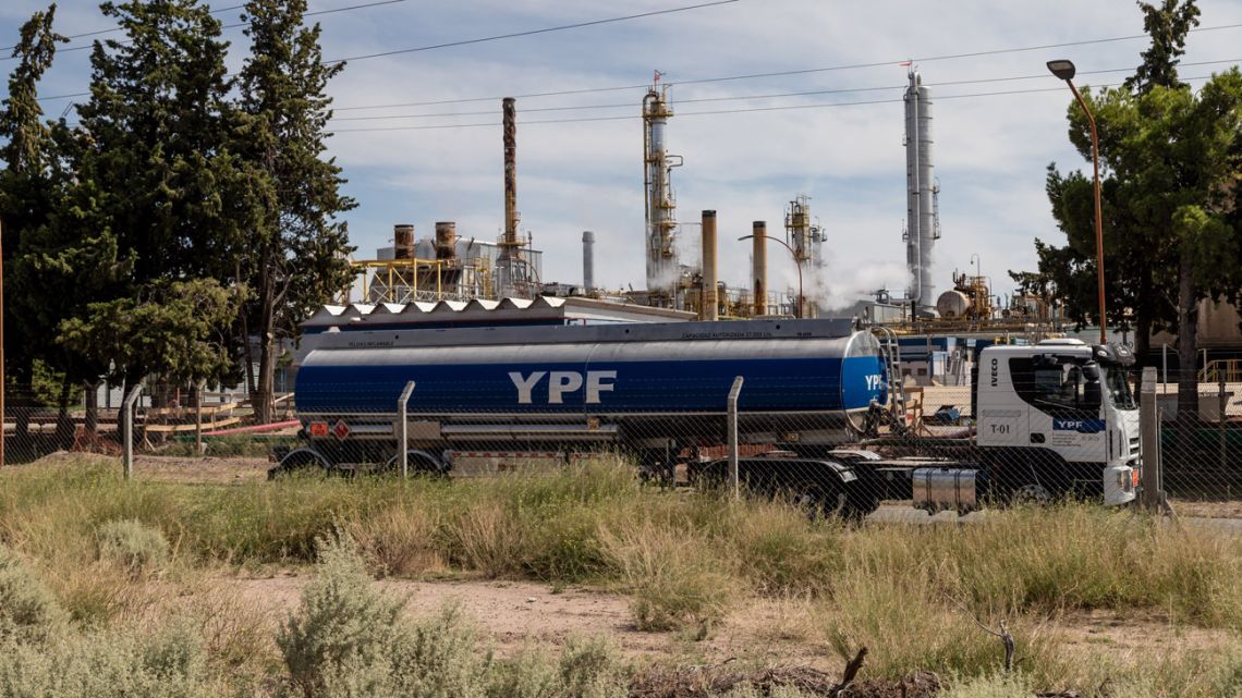 A truck passes a YPF SA facility in Plaza Huincul, Neuquén Province, Argentina.