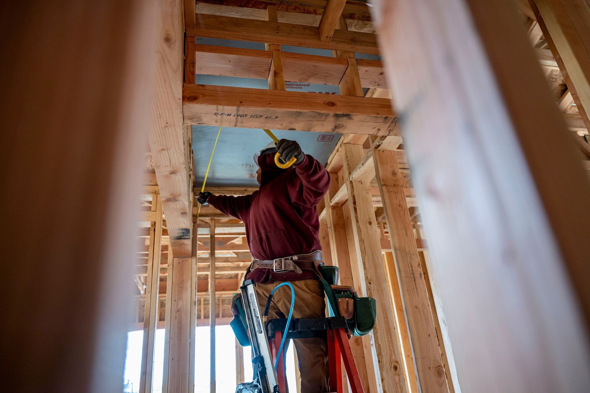 A contractor works in a property under construction in Folsom, California.