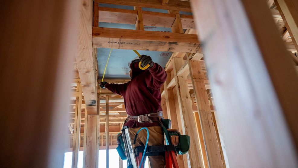 A contractor works in a property under construction in Folsom, California.