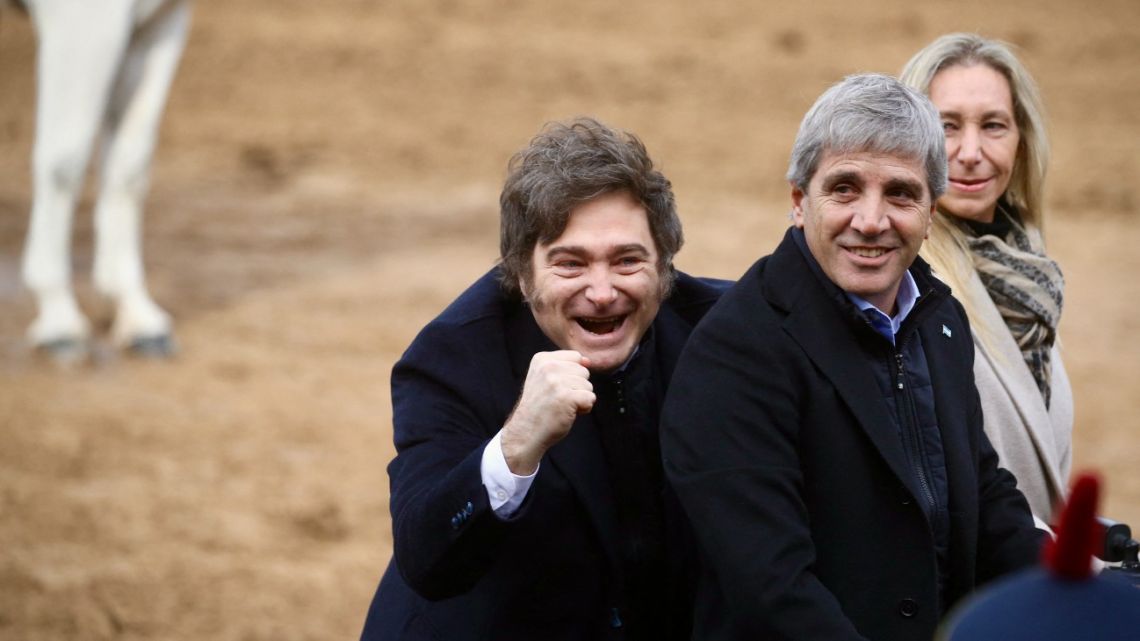 President Javier Milei, his sister Presidential Chief-of-Staff Karina Milei and Economy Minister Luis Caputo arrive at the Argentine Rural Society's expo in Buenos Aires on July 26, 2025. 