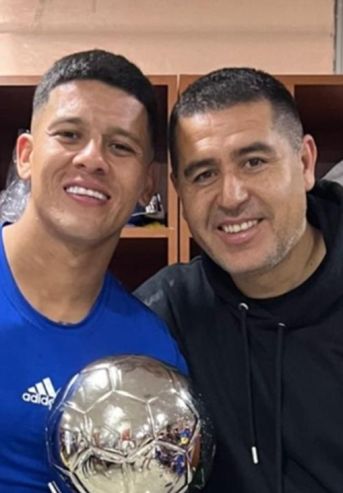 Marcos Rojo y Juan Román Riquelme