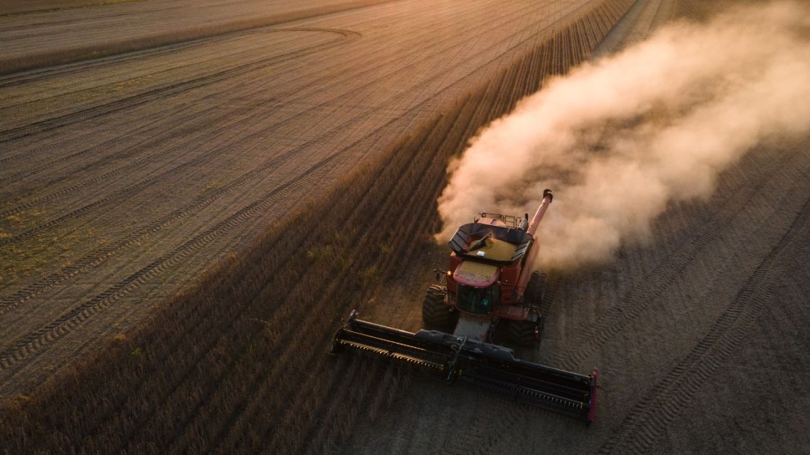 A farmworker harvests soybeans in Pace, Mississippi, United States, on Thursday, October 7, 2021.