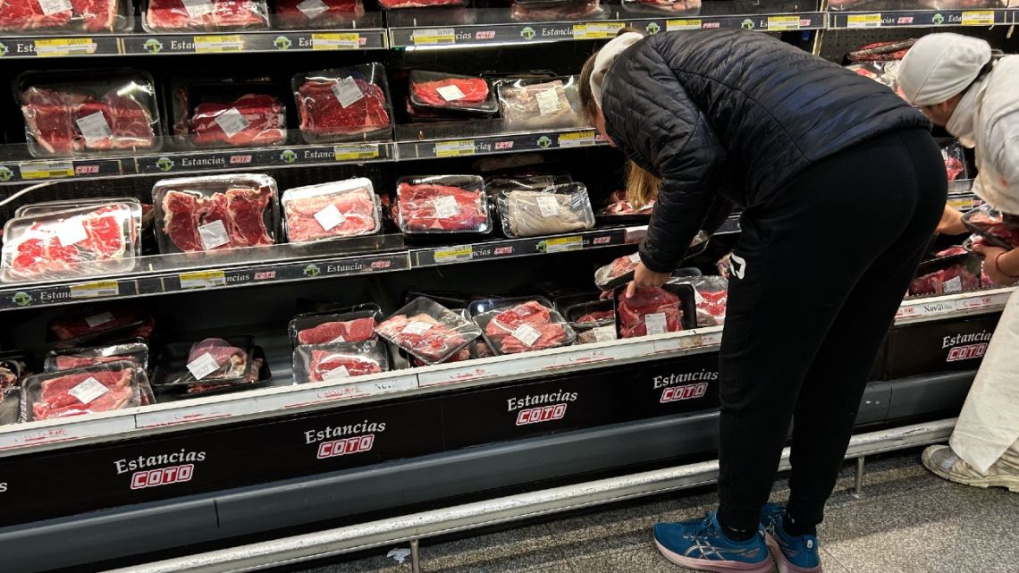 A woman buys beef at a supermarket in Buenos Aires on August 8, 2025. 