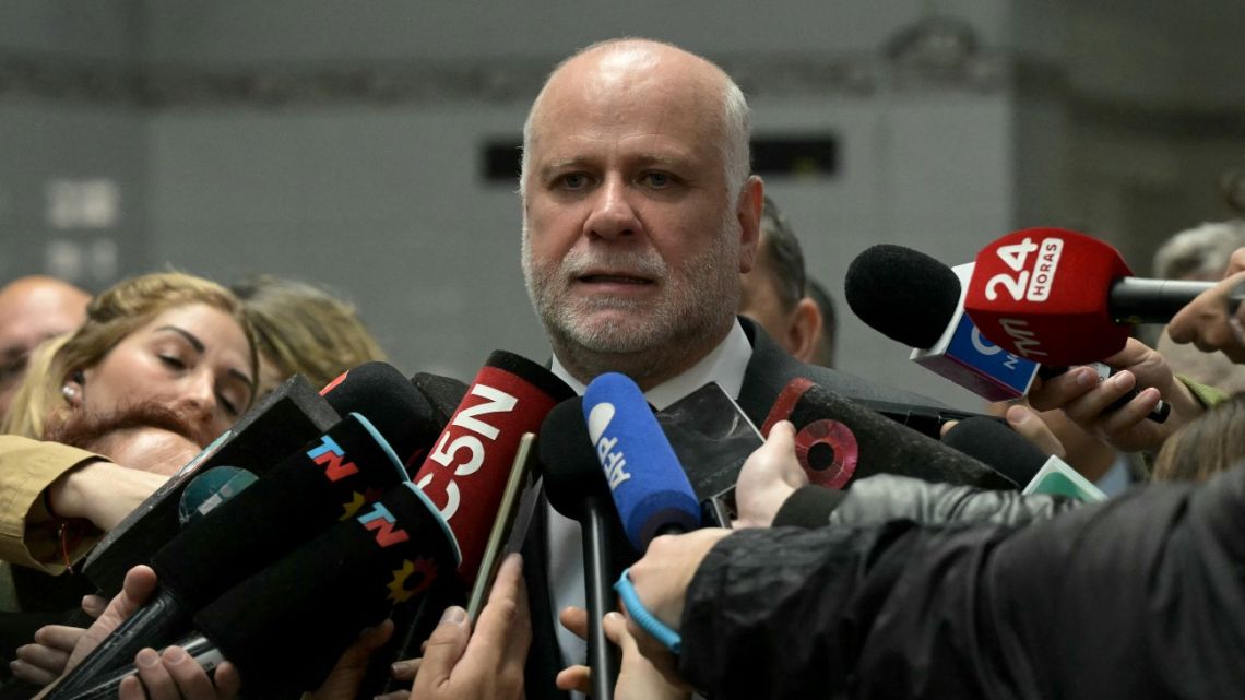 Chile's Interior and Public Security Minister Álvaro Elizalde gives a press conference at the Pedro Fiorito public hospital in Avellaneda, Buenos Aires province, on August 22, 2025, after visiting Universidad de Chile fans hospitalized following the abandonment of a Copa Sudamericana match between Independiente and Universidad de Chile due to sustained crowd violence. Chile's President Gabriel Boric said on Friday that 104 Universidad de Chile fans detained in Argentina after clashes during the Copa Sudamericana match against Independiente had been released. 