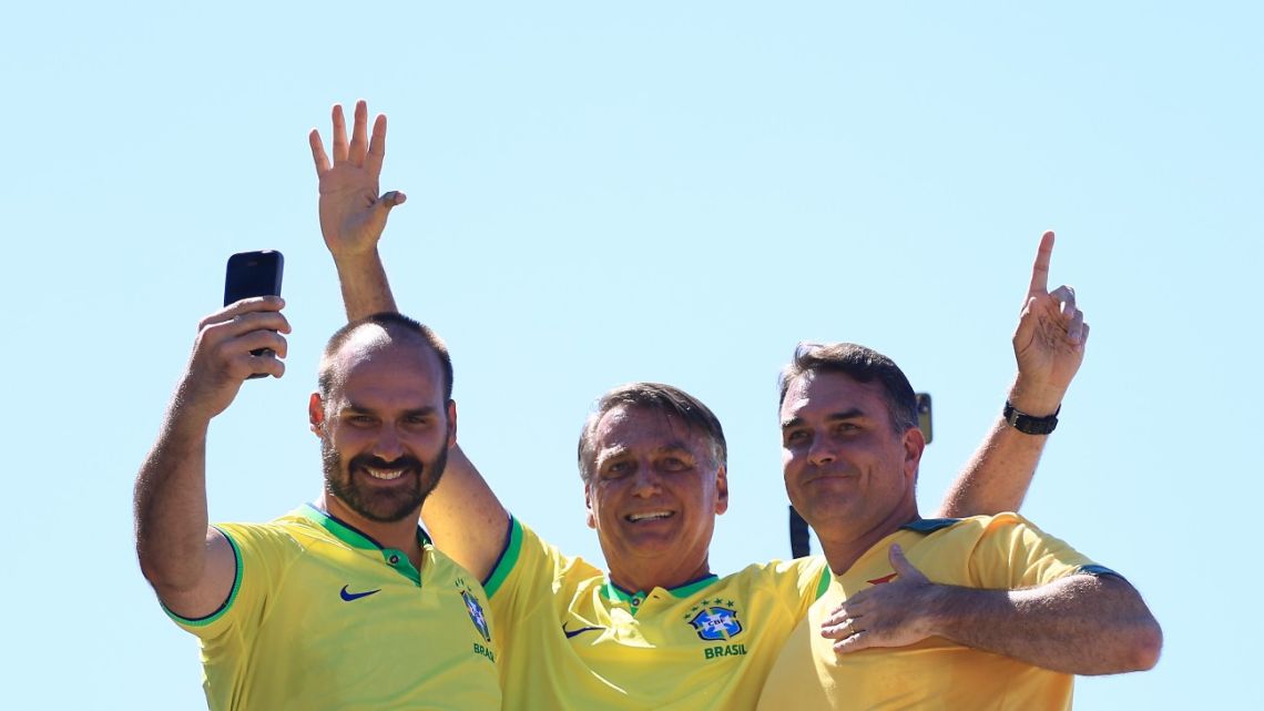 Former Brazilian President Jair Bolsonaro, centre, and his sons Eduardo Bolsonaro, left, and Flavio Bolsonaro in Rio de Janeiro in 2024. 