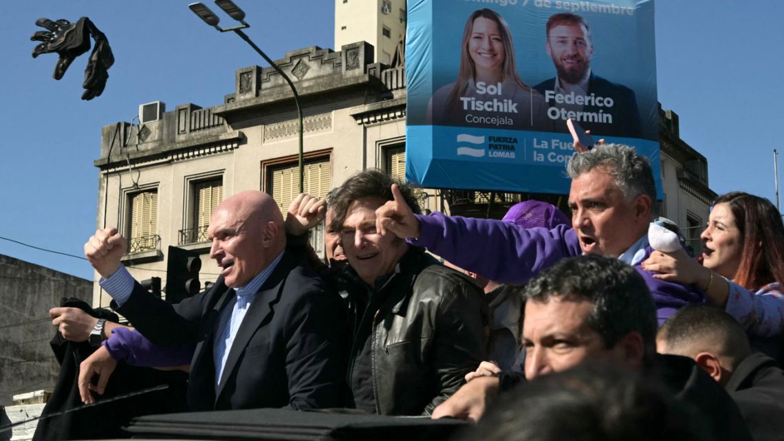 Protesters throw objects at President Javier Milei, other officials and candidates during a motorcade in Lomas de Zamora, Buenos Aires Province, Argentina, on August 27, 2025.