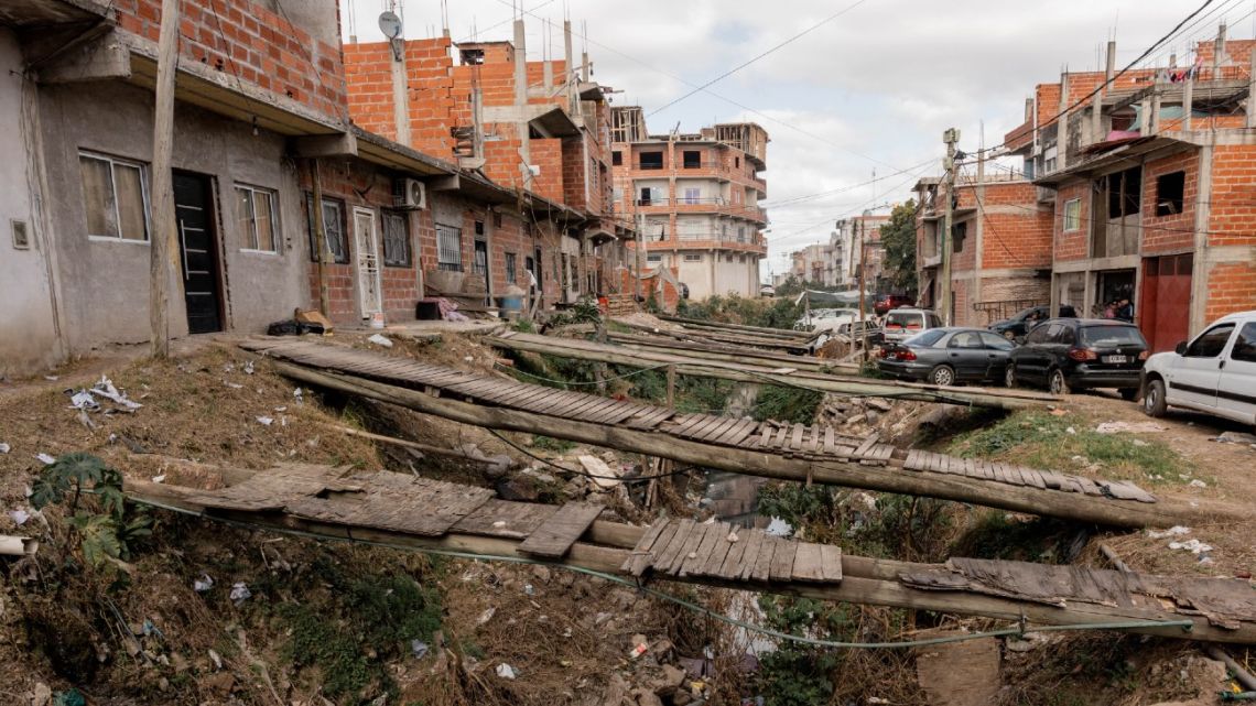 A garbage-strewn stream next to homes in La Matanza. 