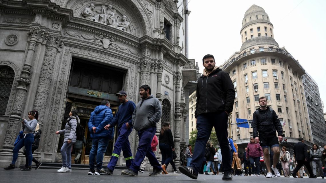 People walk in the financial district of Buenos Aires on September 8, 2025.