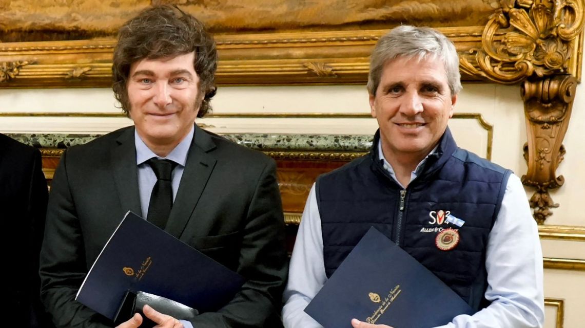 Handout picture released by Argentina's Presidency shows President Javier Milei and Economy Minister Luis Caputo at the Casa Rosada in Buenos Aires, on September 15, 2025.