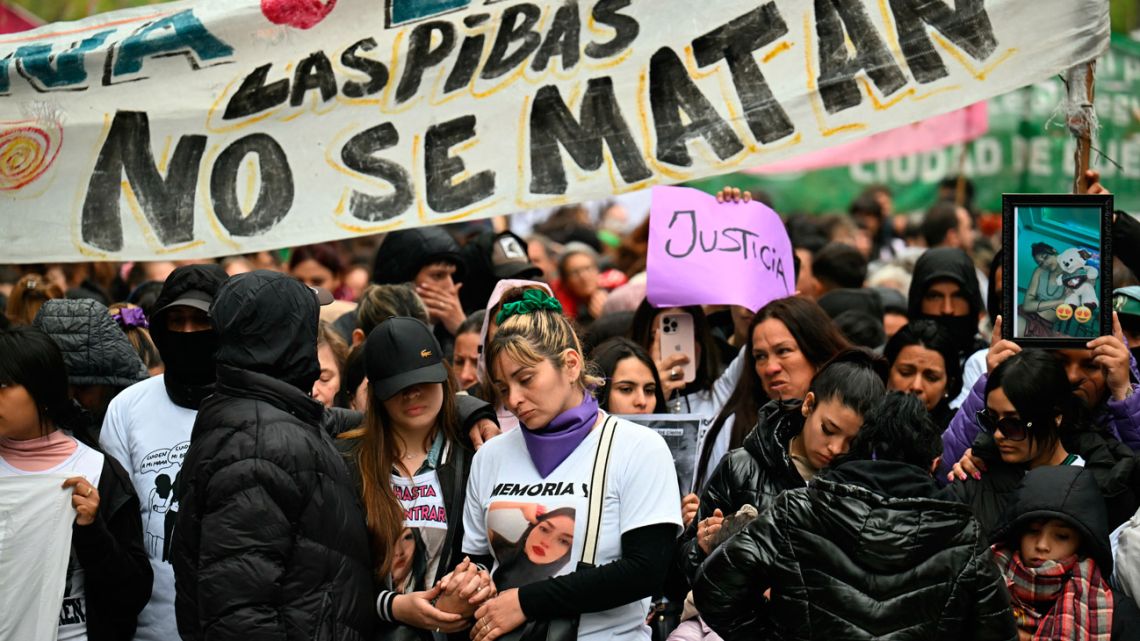 Relatives and friends of three murdered young women attend a protest in Buenos Aires. The bodies of Morena Verdi and Brenda Del Castillo, cousins aged 20, and 15-year-old Lara Gutierrez were found buried last September 24 in the yard of a housé in Florencio Varela, five days after they went missing. 