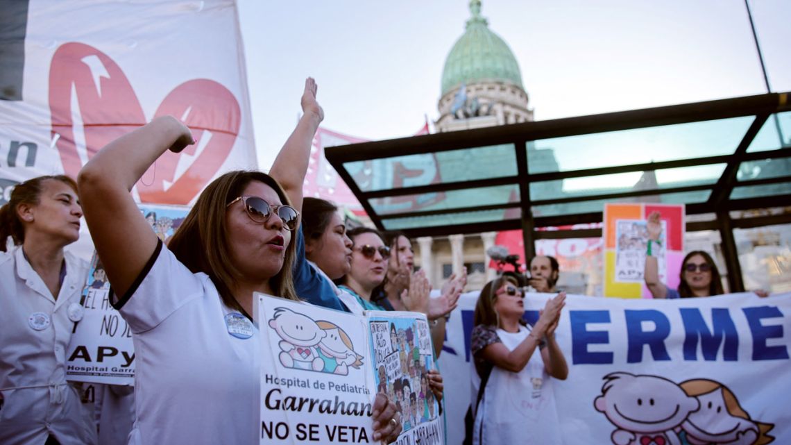 Demonstrators celebrate in front of the National Congress that the Argentine Senate overturned two vetoes by the government in Buenos Aires on October 2, 2025. 