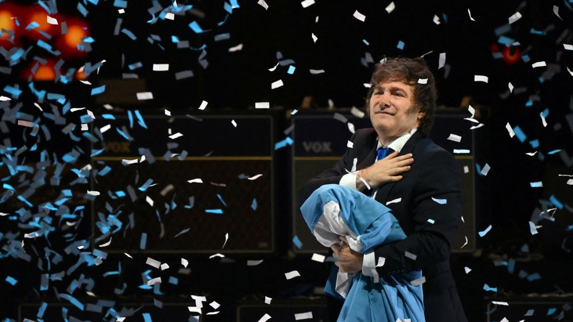 Argentina's President Javier Milei gestures during the launch of his new book at the Movistar Arena in Buenos Aires on October 6, 2025. 