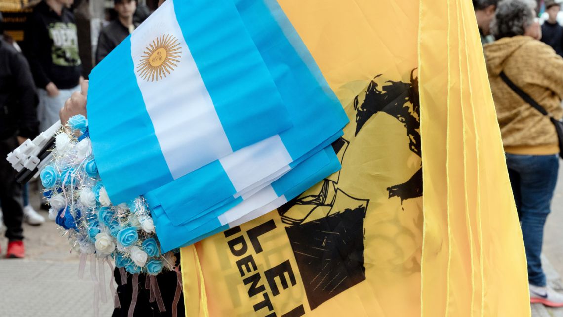 A vendor sells flags during the launch of Javier Milei's latest book in Buenos Aires.