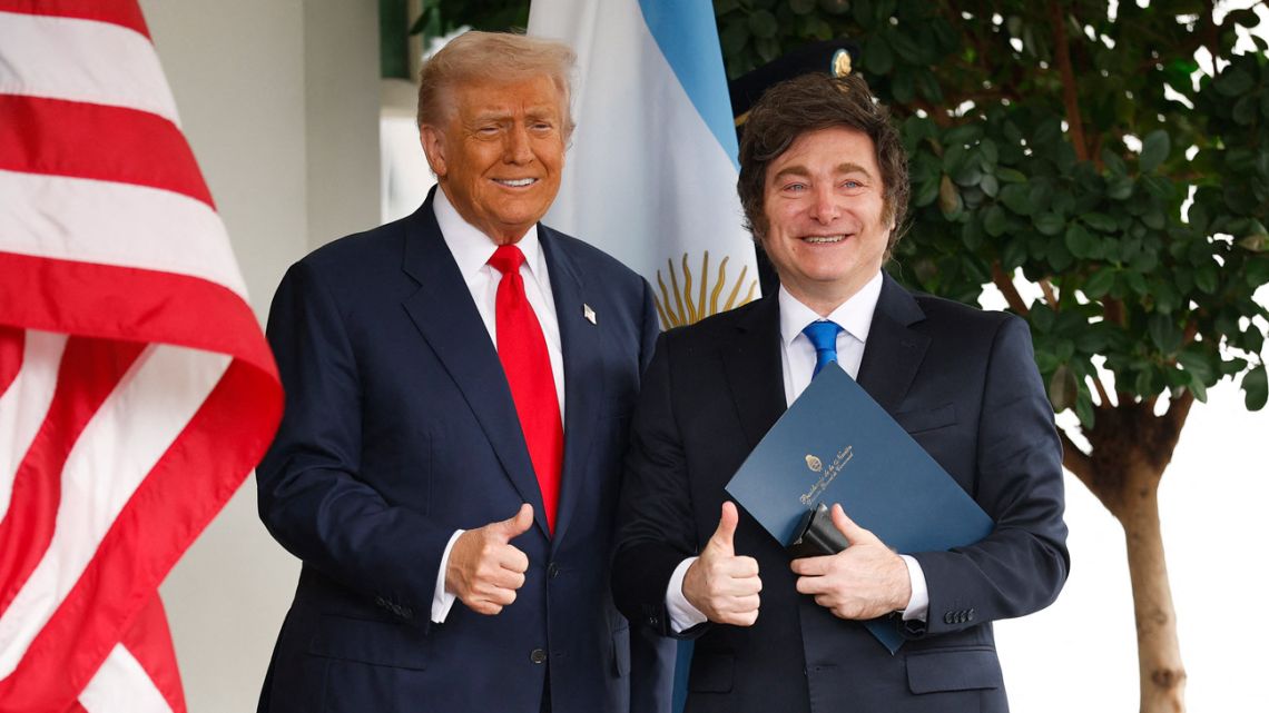 US President Donald Trump greets Argentina's President Javier Milei as he arrives at the West Wing of the White House on October 14, 2025 in Washington, DC. 