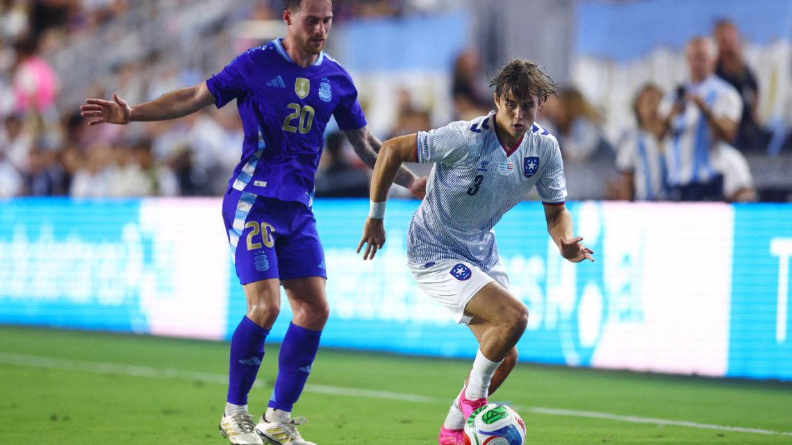 Diego Rossi controls the ball whilst under pressure from Alexis Mac Allister of Argentina during the International Friendly match between Puerto Rico and Argentina at Chase Stadium on October 14, 2025 in Fort Lauderdale, Florida. 