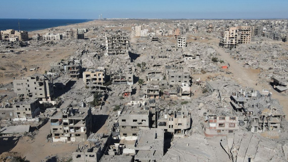 An aerial view shows the Al-Maqussi Towers district, heavily damaged by massive Israeli bombardment over the past two years, in northwestern Gaza City on October 15, 2025, during a US-brokered ceasefire between Israel and Palestinian factions. 