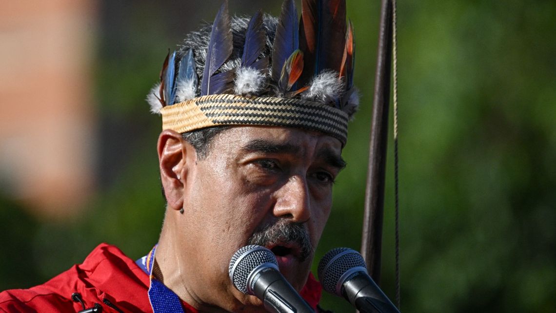 Venezuela's President Nicolás Maduro speaks during a march to commemorate the 'Day of Indigenous Resistance' in Caracas on October 12, 2025. 