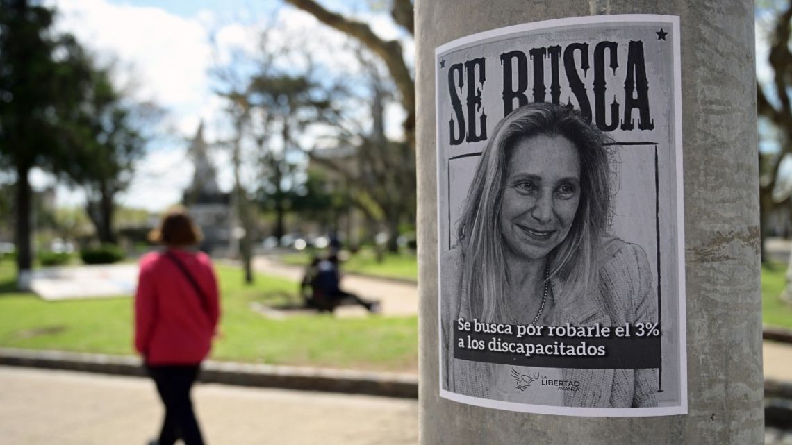 A 'Wanted' poster depicting Presidential Chief-of-Staff Karina Milei that reads, "Wanted for stealing 3% from the disabled" is seen plastered on a post of the main square of the rural town of San Andrés de Giles in Buenos Aires Province, Argentina on September 24, 2025.