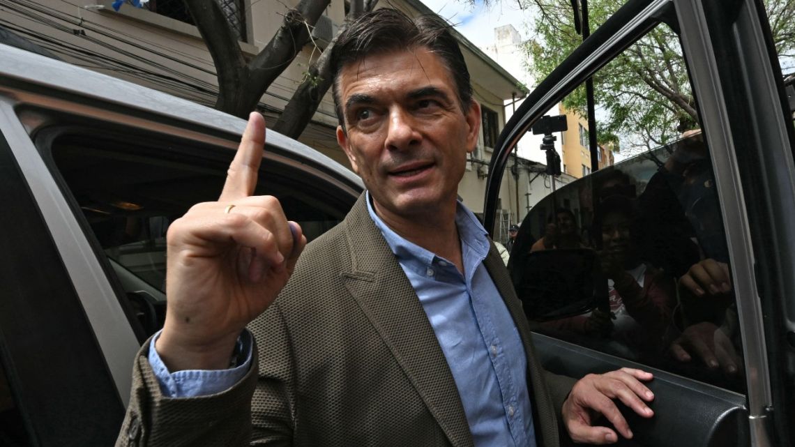 Bolivia's presidential candidate for the Christian Democratic Party (PDC), Rodrigo Paz, gestures as he leaves after voting during the presidential runoff election in Tarija, Bolivia, on October 19, 2025. 