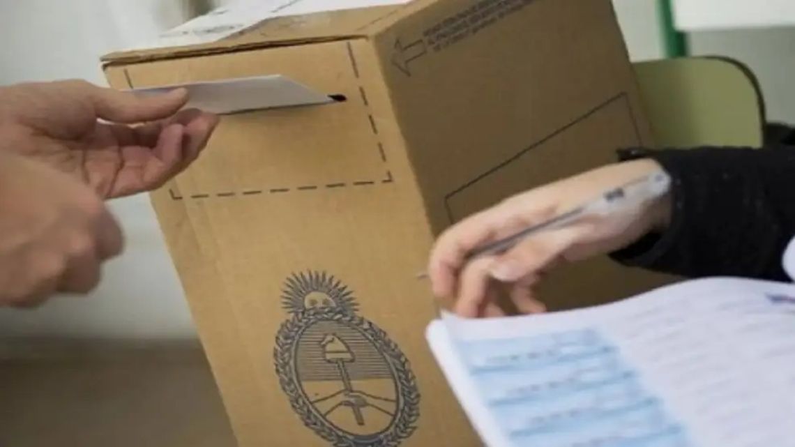 Casting a vote at the ballot box.