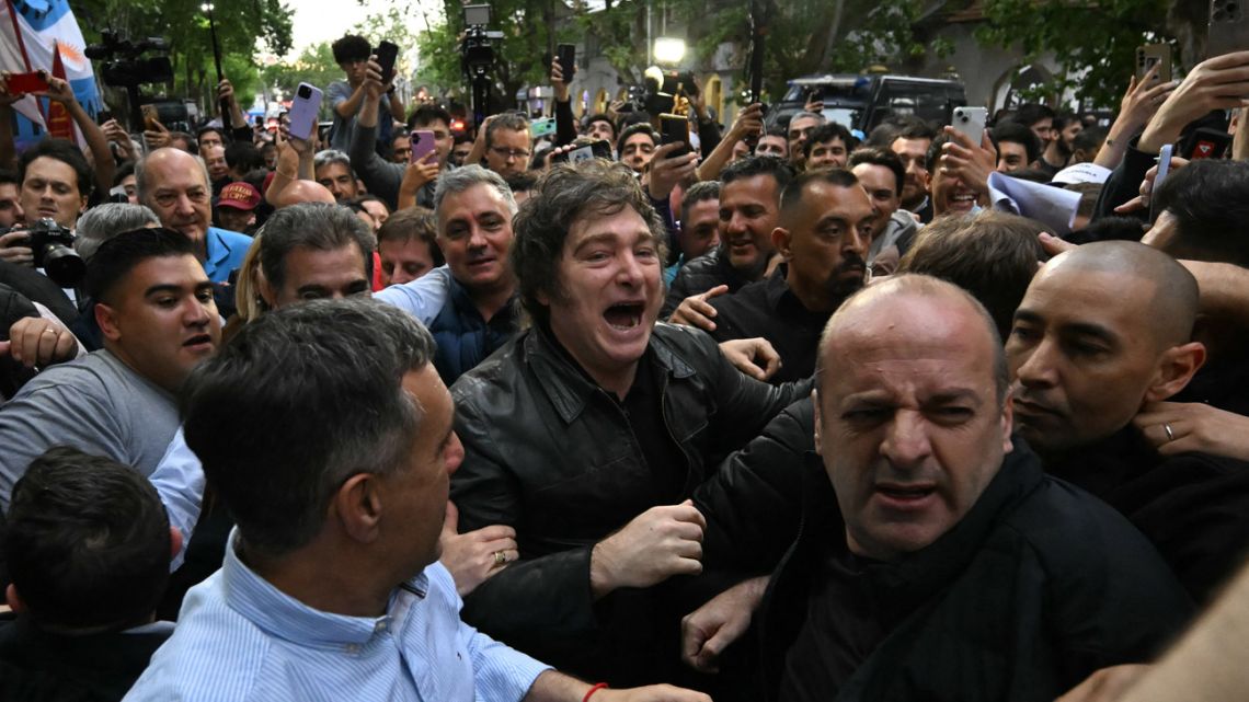 Argentina's President Javier Milei greets supporters during a campaign rally ahead of the upcoming legislative elections at Tres de Febrero, Buenos Aires Province, on October 17, 2025.