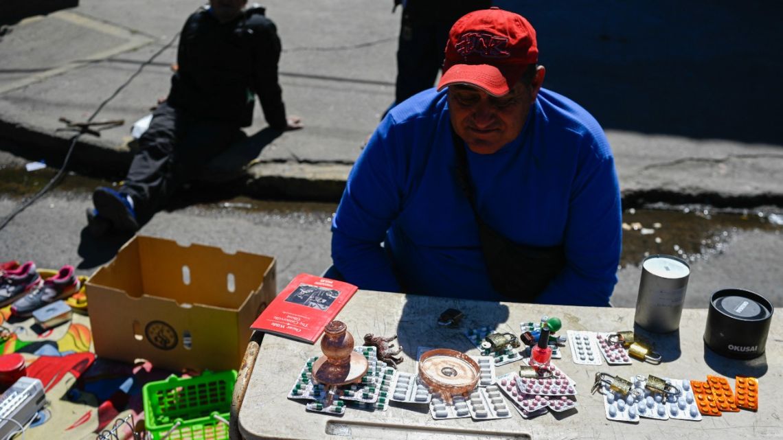 A man sells medicine at a street market in Villa Fiorito, on the outskirts of Buenos Aires, on October 19, 2025. The street market in the neighborhood where Diego Maradona was born keeps growing: more and more residents are selling what they have — or what they find on the street — to survive, amid a deepening economic crisis in Argentina on the eve of the elections.