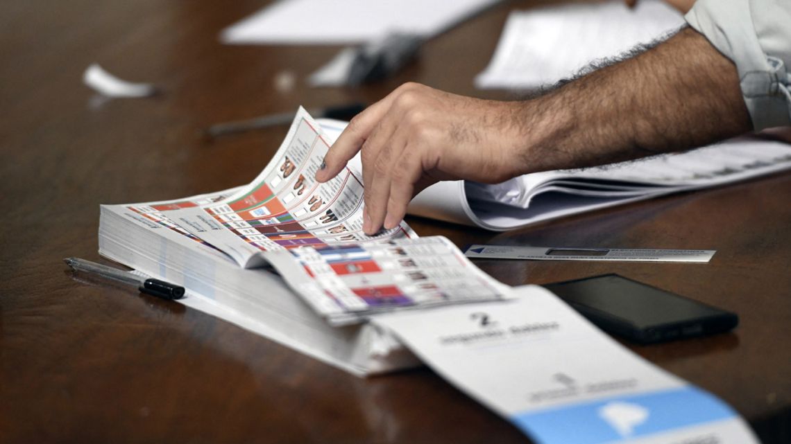 An election official works at a polling station during the national midterm legislative election in La Plata, Buenos Aires Province, Argentina, on October 26, 2025.