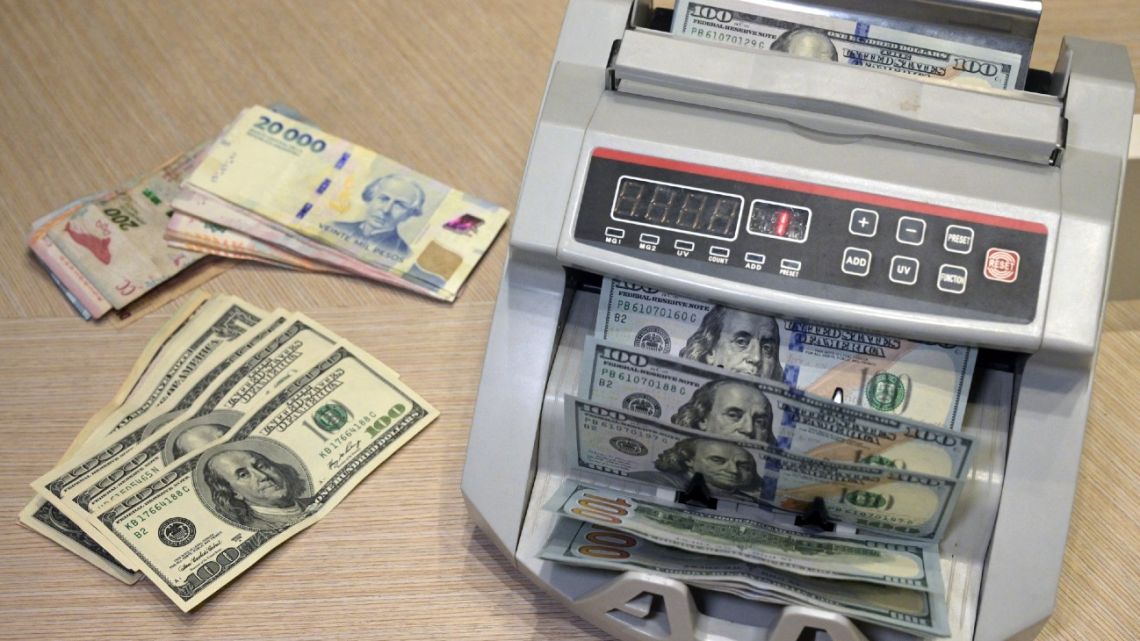 Pesos and dollars at a currency exchange house in Buenos Aires.