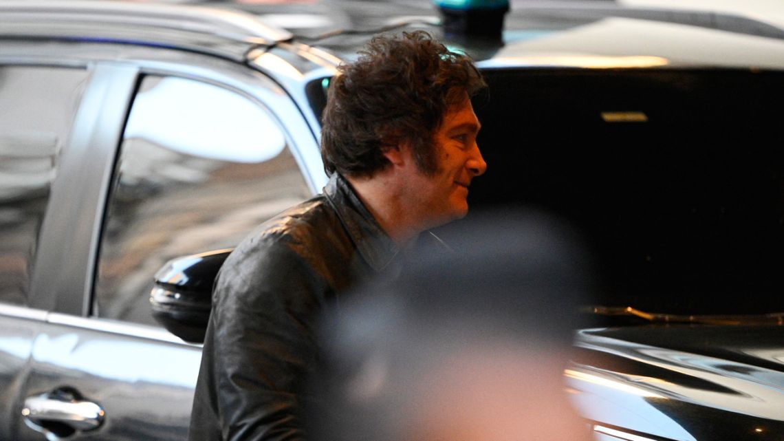 President Javier Milei arrives at the ruling party's La Libertad Avanza headquarters during the national midterm legislative election, in Buenos Aires on October 26, 2025.